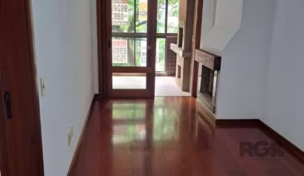 Apartamento 1 dormitório com vaga/box/garagem escriturada; imóvel de frente, sacada integrada com churrasqueira, lareira, piso taboão no living e laminado no dormitório, cozinha americana, banheiro so