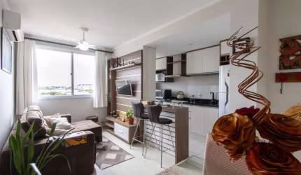 Lindo apartamento no bairro Cavalhada, piso laminado, 02 dormitórios, sendo 01 com armários sob medida, living 02 ambientes, cozinha americana mobiliada, área de serviço com tanque e aquecedor, banhei