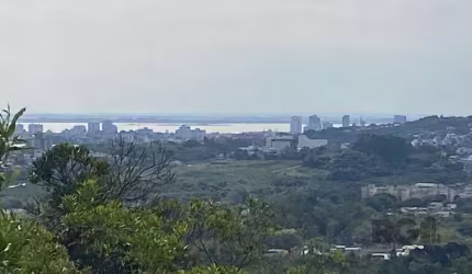 ÁREA 2400m² BAIRRO CAMPO NOVO PORTO ALEGRE RS. Projeto em aprovação p construção de 2.450m². 20m frente x 120m profundidade, rua asfaltada, onibus em frente, pronto p construir. confira!