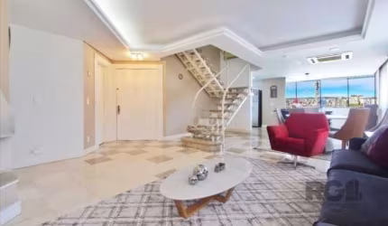 Belíssima cobertura com 327 m² privativos no bairro Bela Vista em Porto Alegre. 4 dormitórios (2 suítes ),  6 banheiros, living 2 ambientes com lareira,  espaço gourmet equipado com churrasqueira, coz