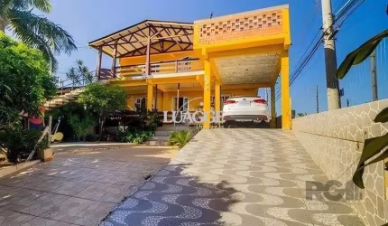 casa de 4 dormitórios,  no bairro Lomba do Pinheiro