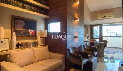 Sala mobiliada, com churrasqueira para happy hour e vista para o Guaíba