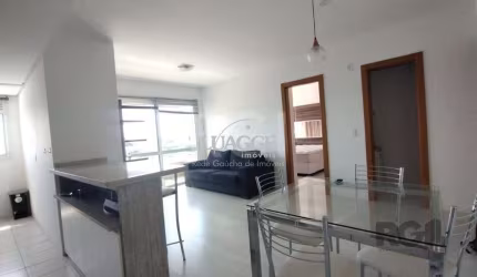 Apartamento mobiliado, 57m2, 1 suite, 1 vaga, lareira e churrasqueira, localizado no bairro Três Figueiras, Porto Alegre/RS.