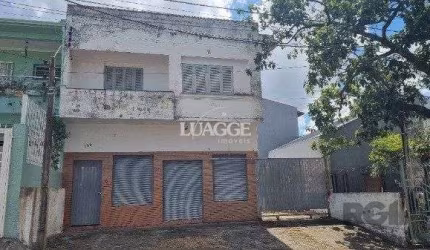 Casa /Sobrado  com apartamento e loja, estacionamento, a venda no Bairro Jardim Itu.  Lojão embaixo com dois banheiros e divisórias,