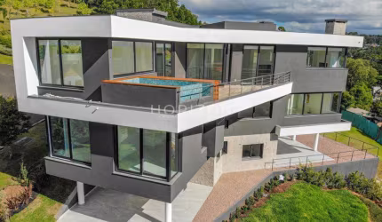 Casa 04 Dorm. à venda no Bairro Alphaville com 570 m² de área privativa - 2 vagas de garagem