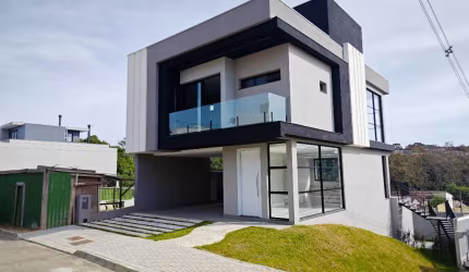 BELISSÍMA CASA EM UM CONDOMÍNIO COM 3 SUÍTES 4 VAGAS