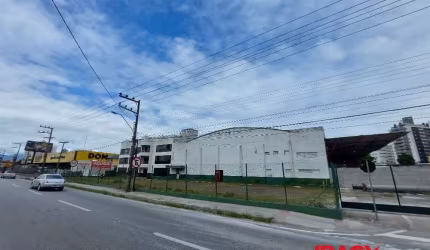 Total terreno  11.982,50 m² (frente para BR-101), Área do Galpão + escritório = 4.009,51 m².  Prédio