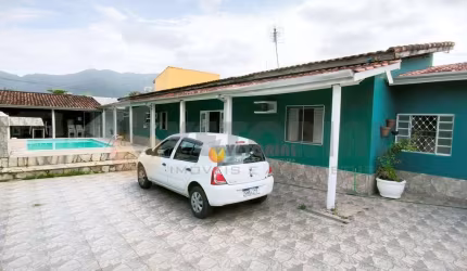 Casa com 3 dormitórios à venda, 130 m² por R$ 550.000 - Jardim Tarumãs - Caraguatatuba/SP