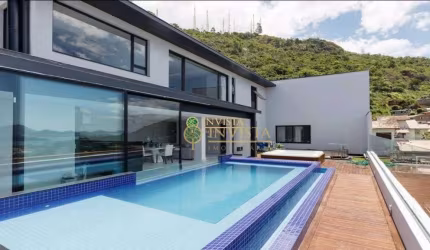 Varanda gourmet com piscina e jacuzzi, vista Mar e 4 quartos - À venda próximo à UFSC na Trindade.