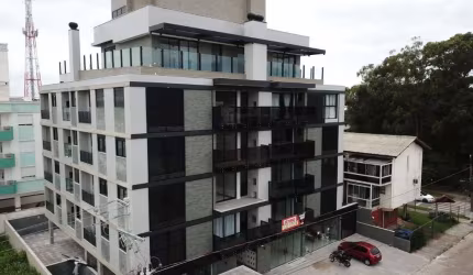Novo com 2 quartos, sacada com churrasqueira e 1 vaga livre à venda em Canasvieiras.