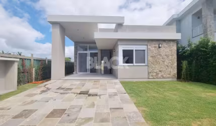 Casa térrea com 04 suítes no Condomínio Ilhas Park em Torres RS