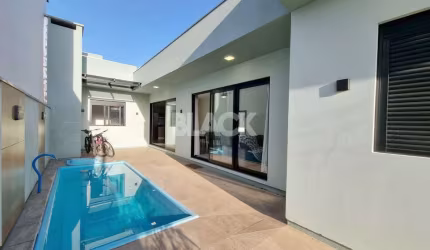 Casa com piscina no Morada das Palmeiras em Torres RS