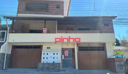 Apartamento com 1 dormitório para alugar, 50 m² por R$ 1.567,80/mês - Forquilhas - São José/SC