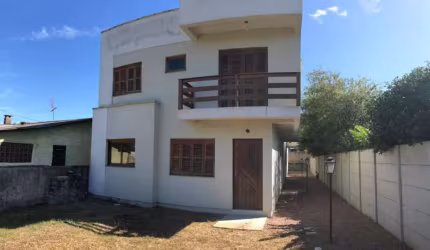 Casa 2 dormitórios com suíte em condomínio