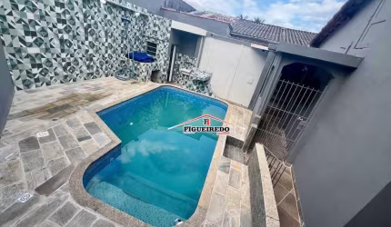 Casa com 2 dormitórios à venda, 182 m² por R$ 570.000 - Caiçara - Praia Grande/SP