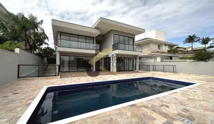 Casa para aluguel no Alphaville Campinas, com 4 suítes, lazer comum e garagem para vários carros.