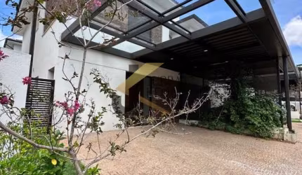 Casa em condomínio à venda no Parque Nova Campinas - Campinas, com 3 suítes, lazer comum e 2 garagens cobertas.
