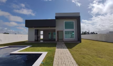 Venha conhecer essa casa espetacular, 3 suítes, sala com pé direito duplo. Condomínio Jacuípe Country-Barra do Jacuípe