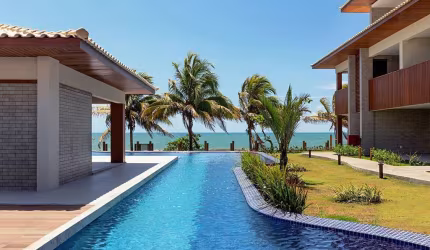 Viva a experiência exclusiva do condomínio pé na arraia, o Mamont Lounge, situado na deslumbrante praia de Itacimirim.
