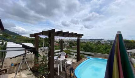 Casa com 3 quartos à venda na Rua Natércia Cunha Veloso, 267, Morro Santana, Porto Alegre, 270 m2 por R$ 798.000