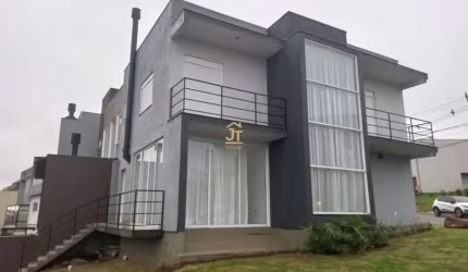 Casa em condomínio fechado com 3 quartos à venda na Rua Antônio Baggio, 100, Loteamento Jardim Timbaúva, Gravataí por R$ 850.000