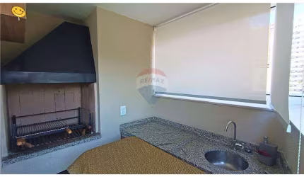 Apartamento com varanda gourmet, 2 dormitórios e 2 vagas à venda em Pitangueiras - Guarujá/SP