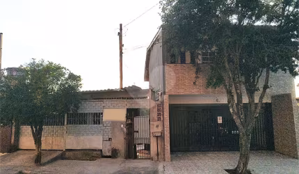 Terreno com 3 casas construídas no Jaraguá