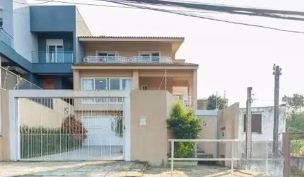 Casa com 3 quartos à venda na Rua Joaquim Cruz, 521, Santo Antônio, Porto Alegre por R$ 1.150.000