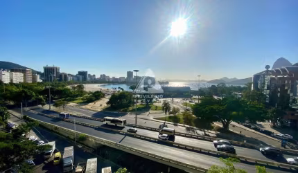 Quarto e sala em Botafogo, vaga e vista Enseada.