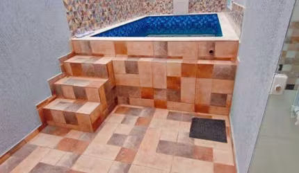 Casa em condomínio com 2 dormitórios e piscina à venda, por R$ 315.000 - Cibratel II - Itanhaém/SP