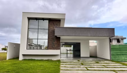 Casa com 3 dormitórios à venda, 129 m² por R$ 820.000,00 - Alphaville Camaçari - Camaçari/BA