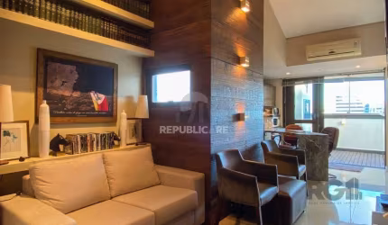 Sala mobiliada, com churrasqueira para happy hour e vista para o Guaíba