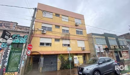 APARTAMENTO DE 2 DORMITÓRIOS, BANHEIRO SOCIAL E LAVABO AUXILIAR NA CIDADE BAIXA.