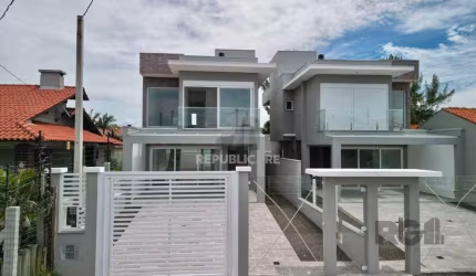 Casa 3 dormitórios à venda Zona Nova Capão da Canoa/RS