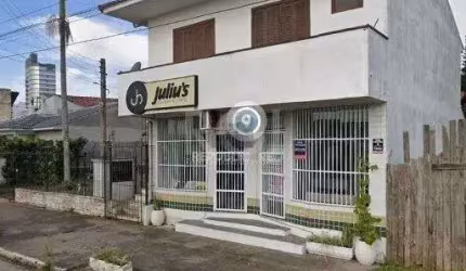 Apartamento de frente com 1 dormitório, sala, cozinha e sacada.