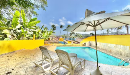 Casa com 3 dormitórios à venda, 150 m² por R$ 1.000.000,00 - Balneário Praia do Pernambuco - Guarujá/SP