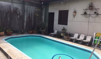 Casa com 4 quartos à venda na Avenida Guido Mondin, 424/430, São Geraldo, Porto Alegre, 308 m2 por R$ 930.000