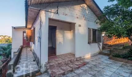 Casa com 5 quartos à venda na Rua Vladimir Herzog, 486, Jardim Carvalho, Porto Alegre, 109 m2 por R$ 332.500