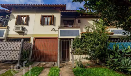 Casa em condomínio fechado com 3 quartos à venda na Rua Itapitocaí, 1031, Cristal, Porto Alegre, 105 m2 por R$ 430.000
