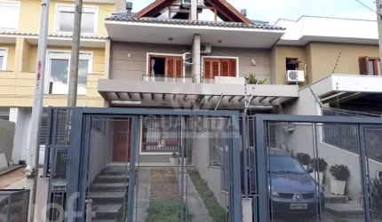 Casa com 3 quartos à venda na Rua Nestor José Nitschke, 48, Hípica, Porto Alegre, 135 m2 por R$ 460.000