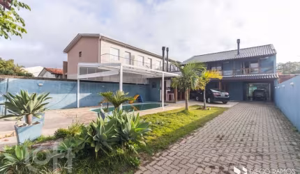 Casa com 4 quartos à venda na Rua Jerolomo Minuzo, 317, Vila Nova, Porto Alegre, 304 m2 por R$ 900.000