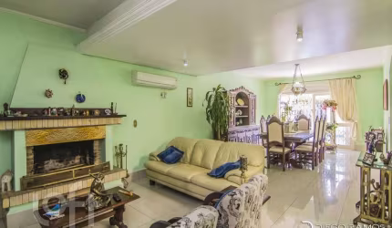Casa com 4 quartos à venda na Rua Menezes Paredes, 208, Nonoai, Porto Alegre, 262 m2 por R$ 1.330.000