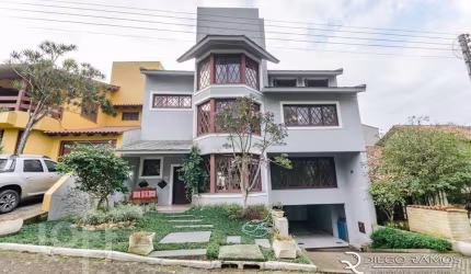 Casa em condomínio fechado com 3 quartos à venda na Rua Tocantins, 869, Agronomia, Porto Alegre, 385 m2 por R$ 1.700.000