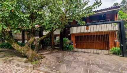 Casa com 4 quartos à venda na Rua Alcebíades Antônio dos Santos, 157, Nonoai, Porto Alegre, 362 m2 por R$ 1.650.000