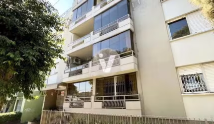Apartamento de dois dormitórios com vaga de garagem, na região central.
