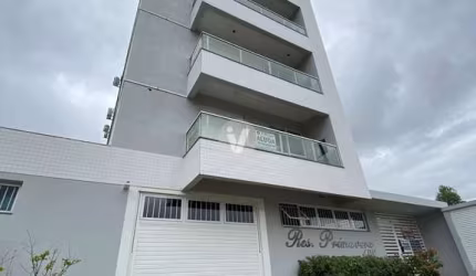 Apartamento de dois dormitório sendo um suíte com vaga de garagem.