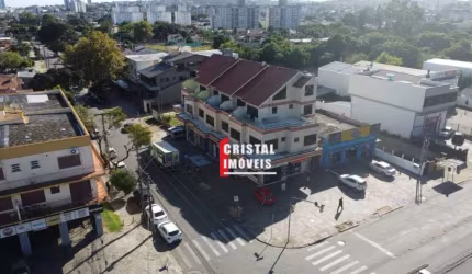 Prédio comercial com 7 lojas e 13 salas comerciais a venda no Bairro Camaquã - A21756