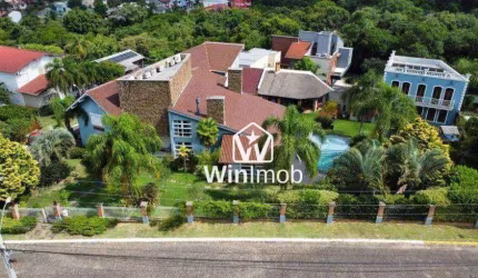 Casa com 5 dormitórios à venda, 450 m² por R$ 3.850.000,00 - Condomínio Cantegril - Viamão/RS