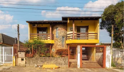 Casa com 3 dormitórios e edícula nos fundos à venda por R$ 699.990,00 no bairro Monte Carlo em Cachoeirinha