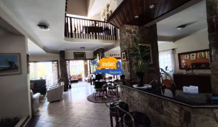 Luxuosa Casa em Condomínio Fechado Frente ao Mar em Bertioga-SP: 4 quartos, 4 suítes, 8 banheiros, 6 vagas, 630m².